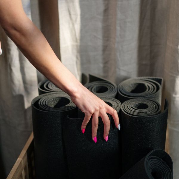 Close up of yoga blocks and a rolled mat